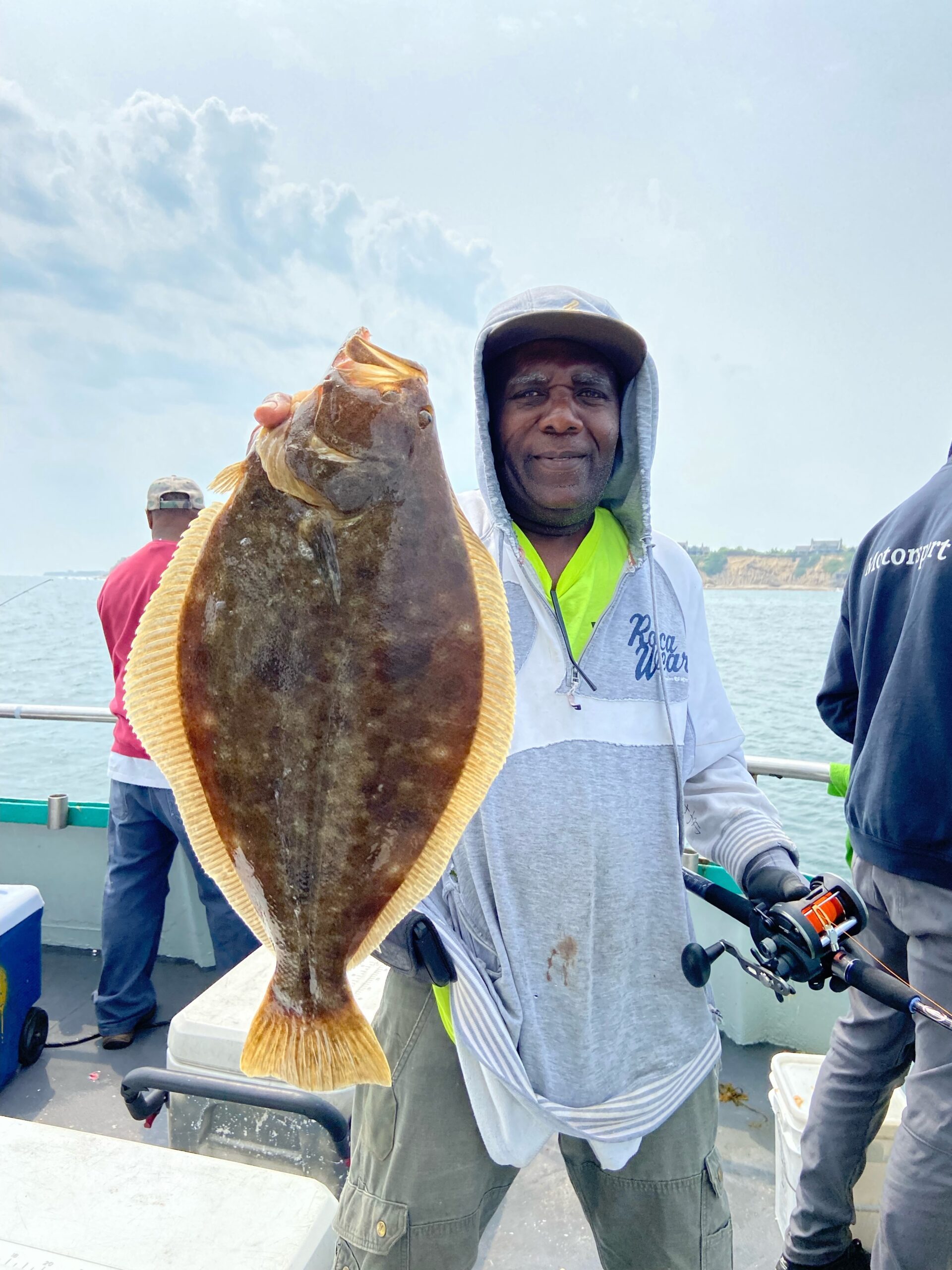 a man standing next to a motorcycle