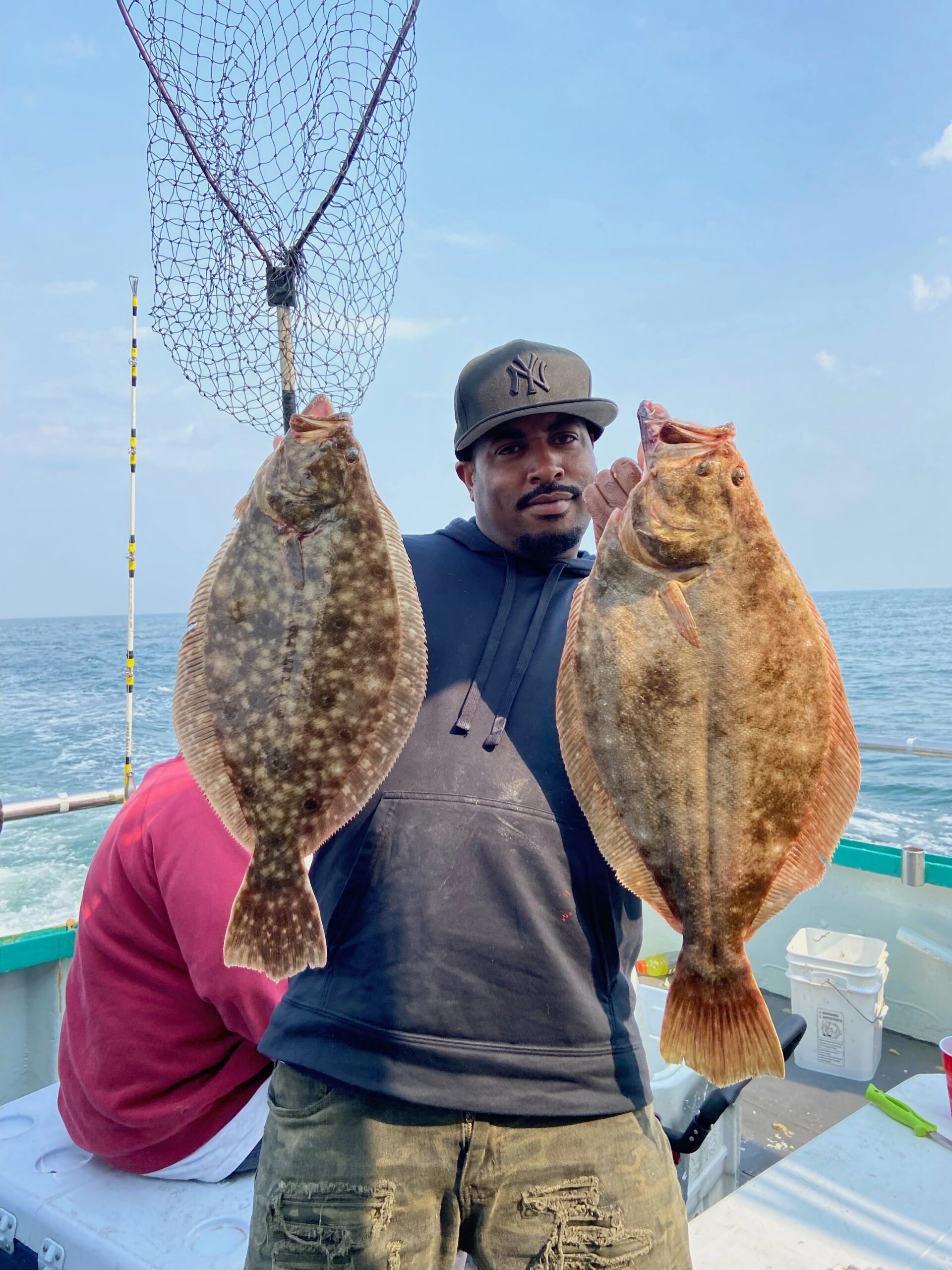 a person holding a fish in the water