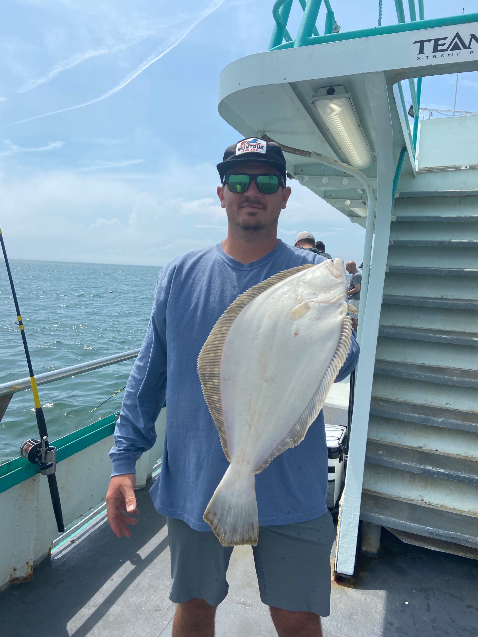 a person holding a fish in the water