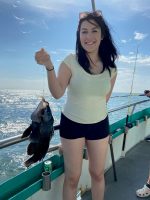 a woman holding a fish