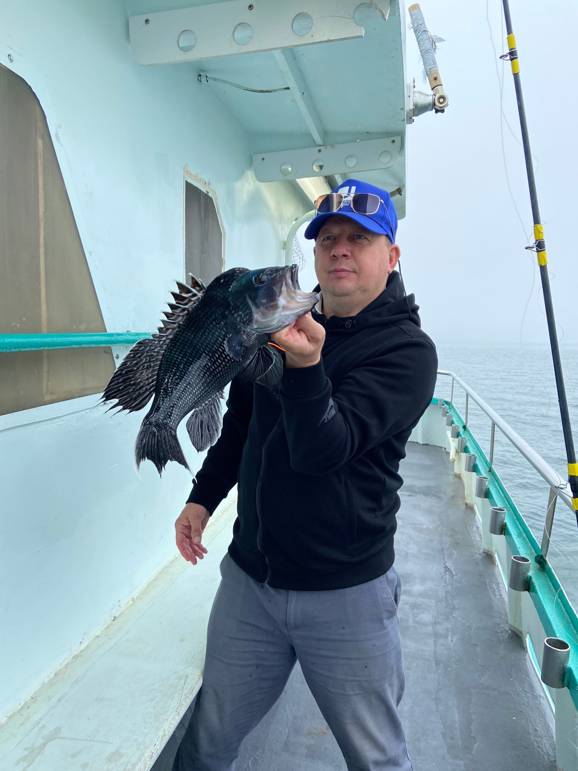 a person holding a fish