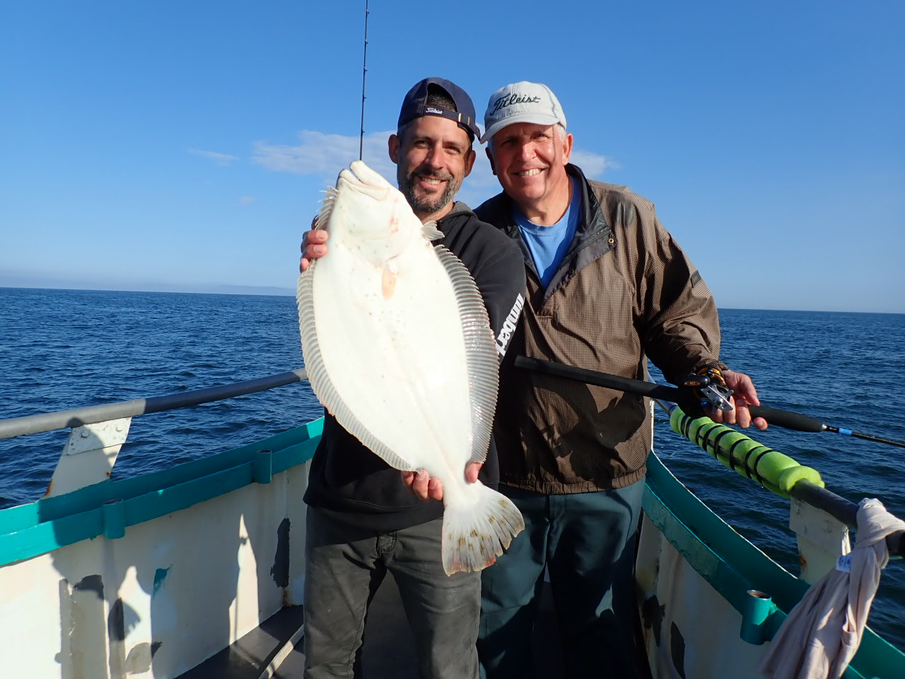 a man holding a fish in the water