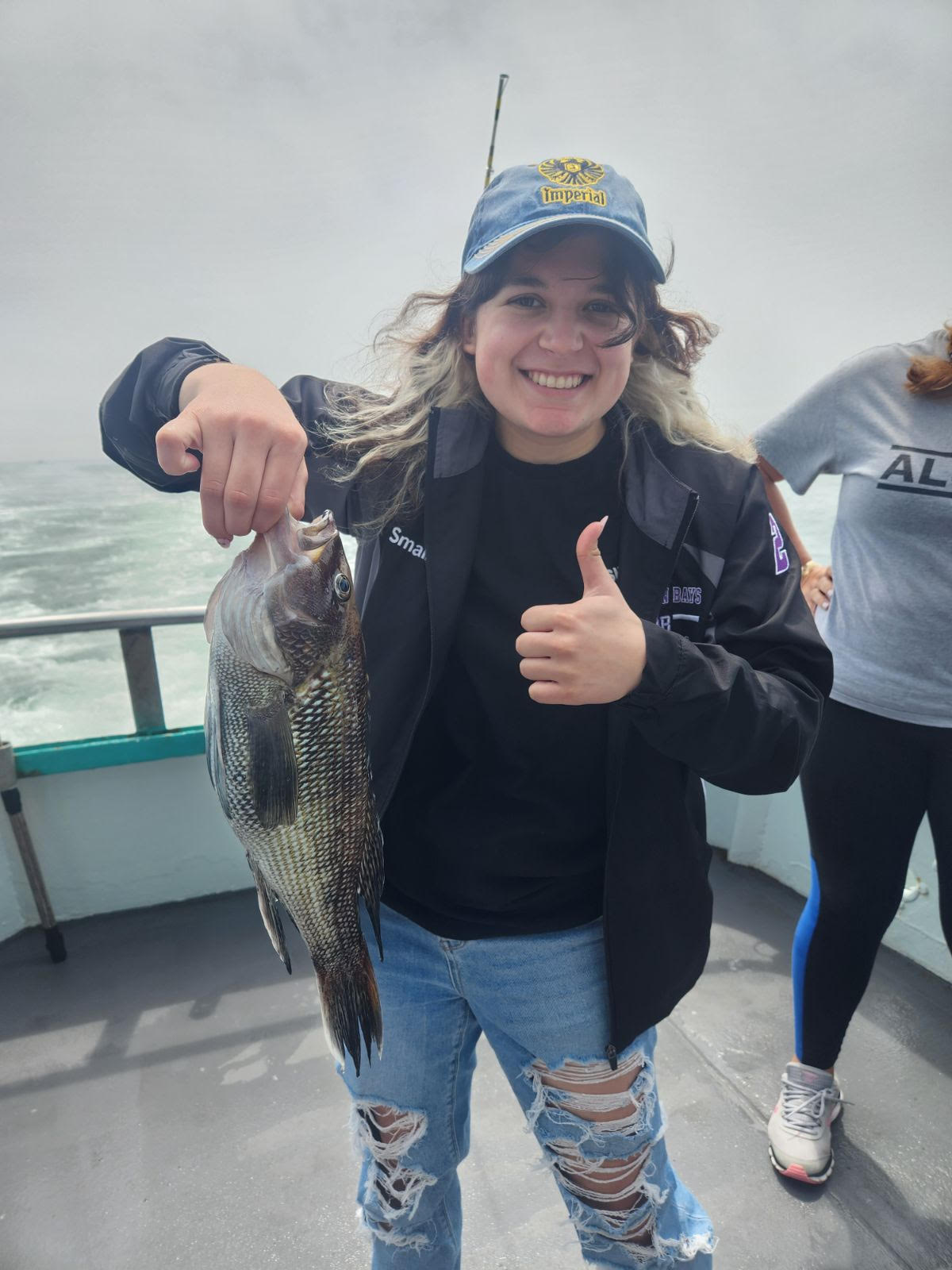 Jessica Sara holding a fish