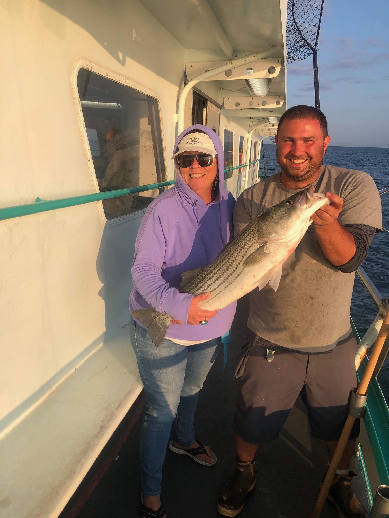a man holding a fish