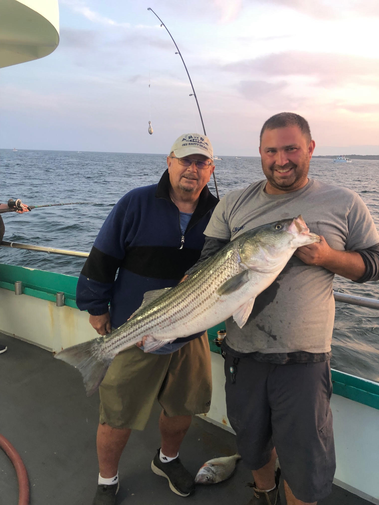 a man holding a fish in the water