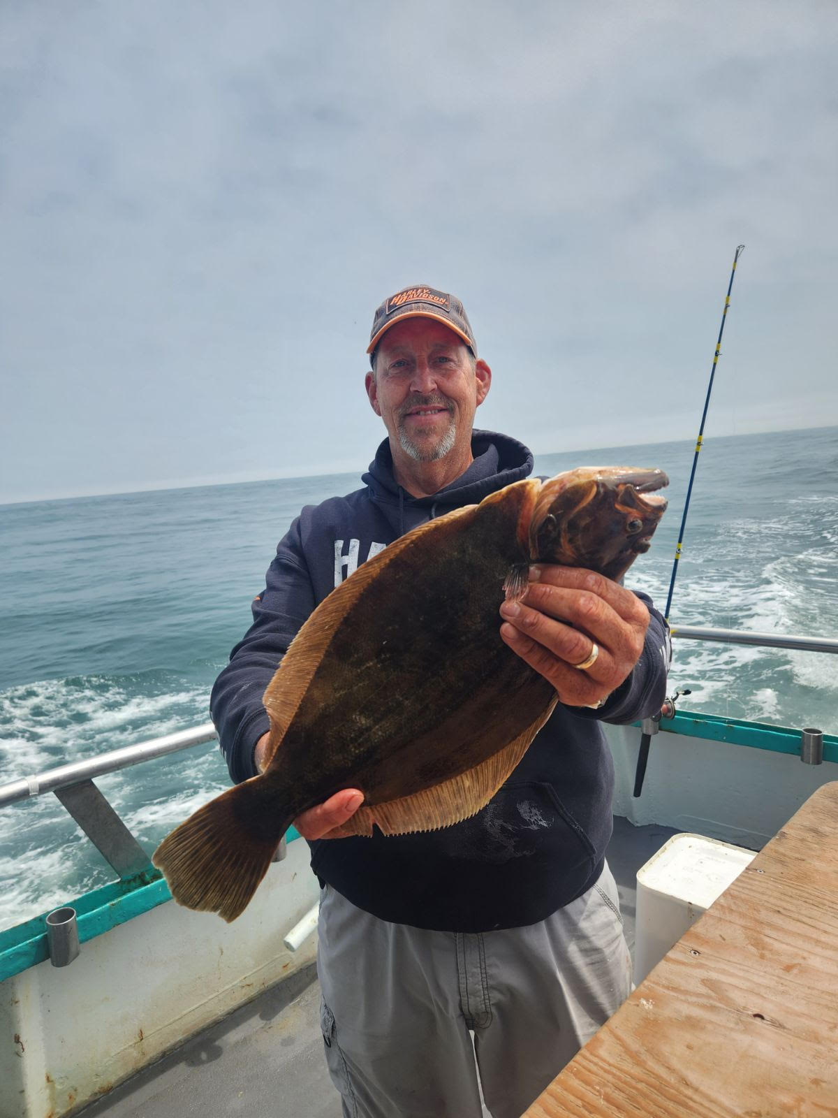 a man holding a fish in the water