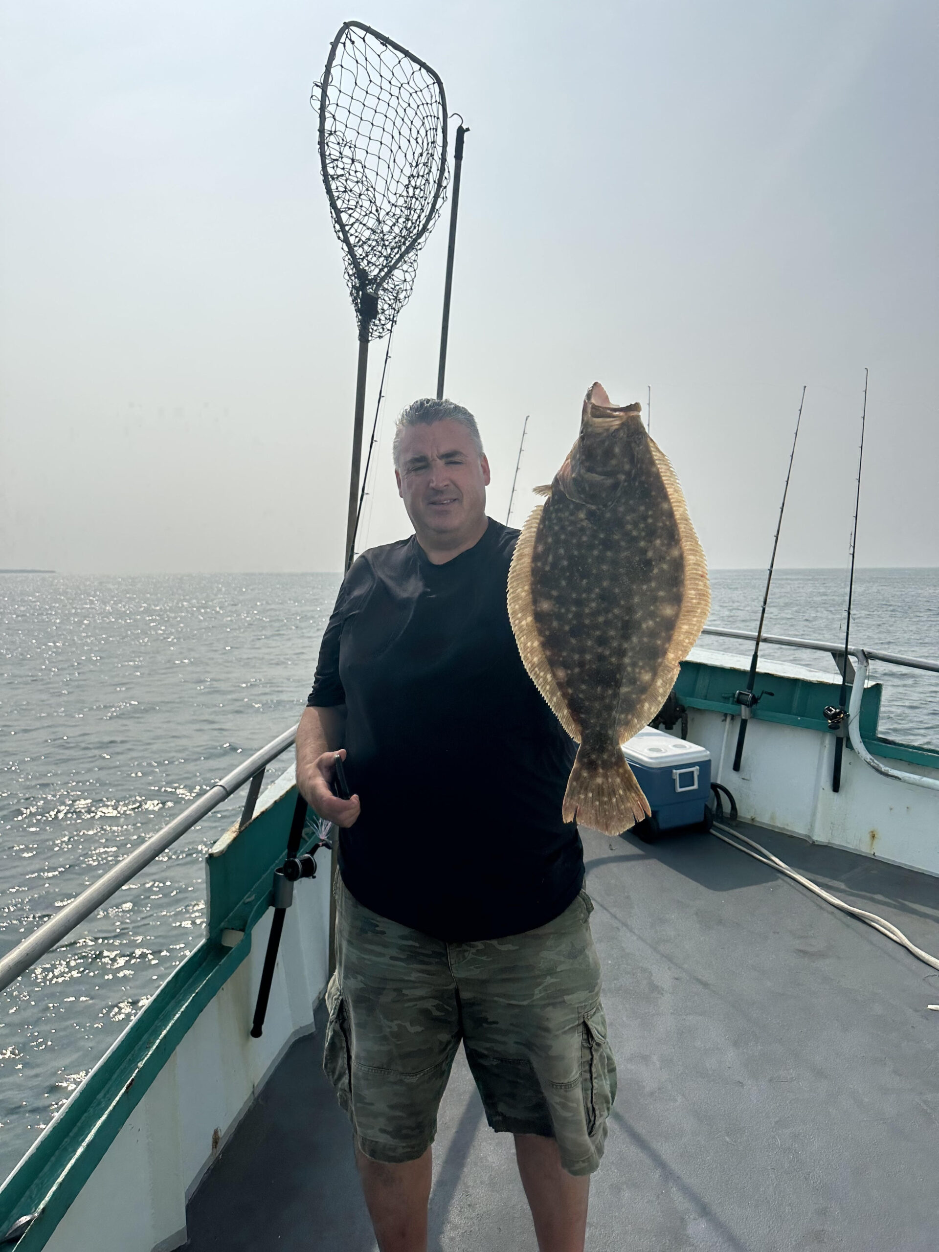 a person standing on a boat in the water