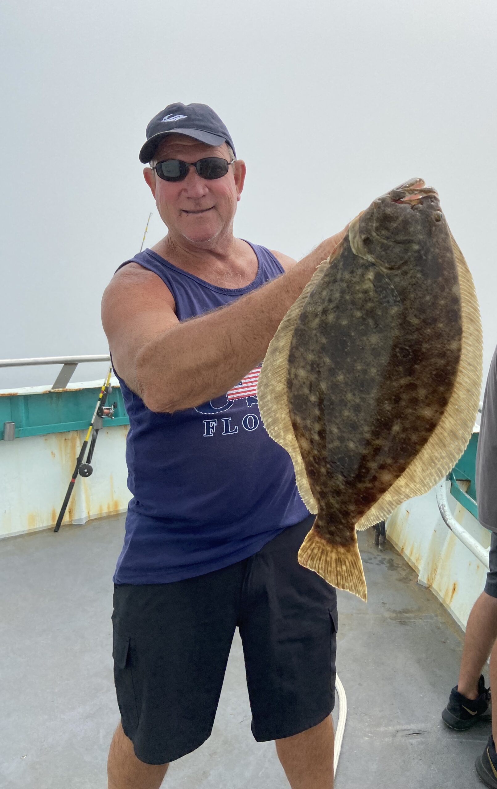a man holding a fish