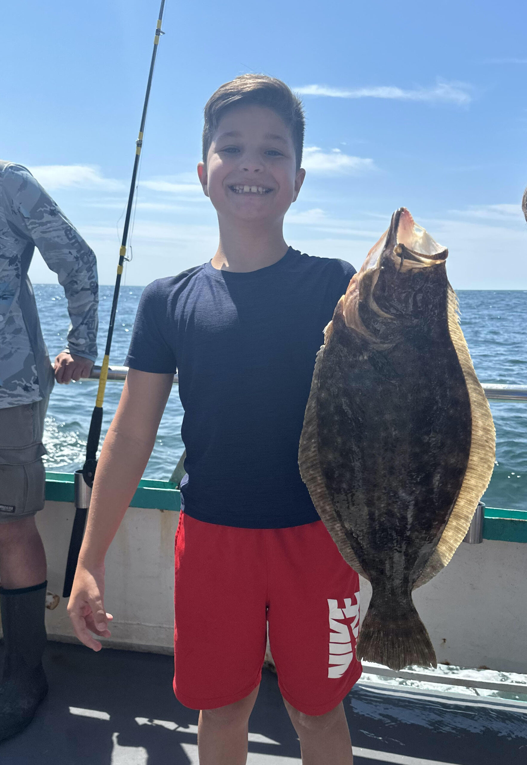 a person holding a fish in the water