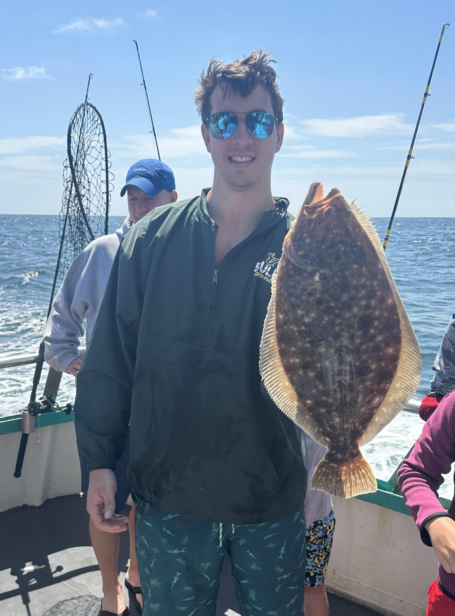 a person holding a fish in the water