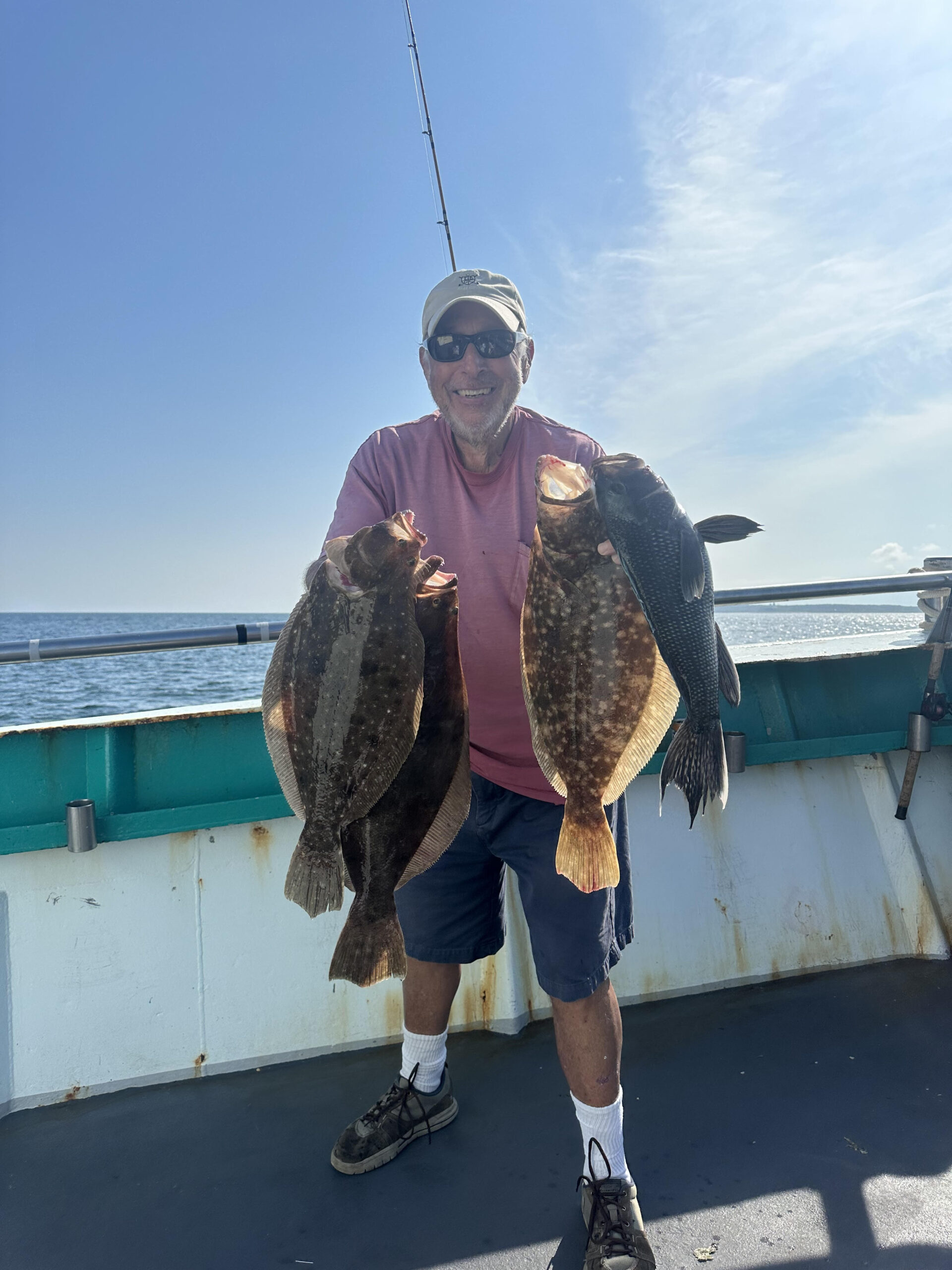 a man holding a fish