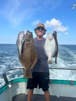 a person holding a fish in the water