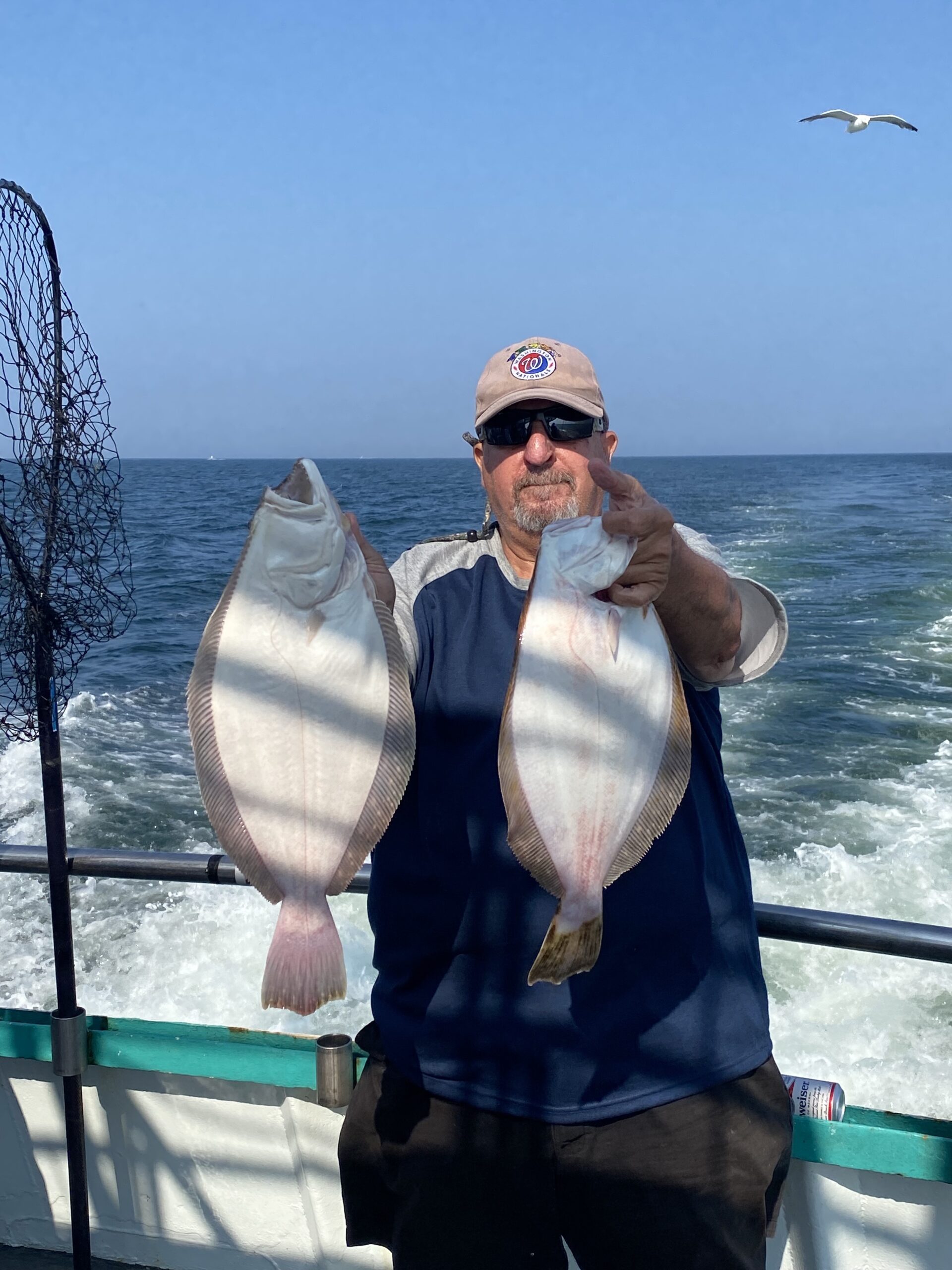 a person standing next to a body of water