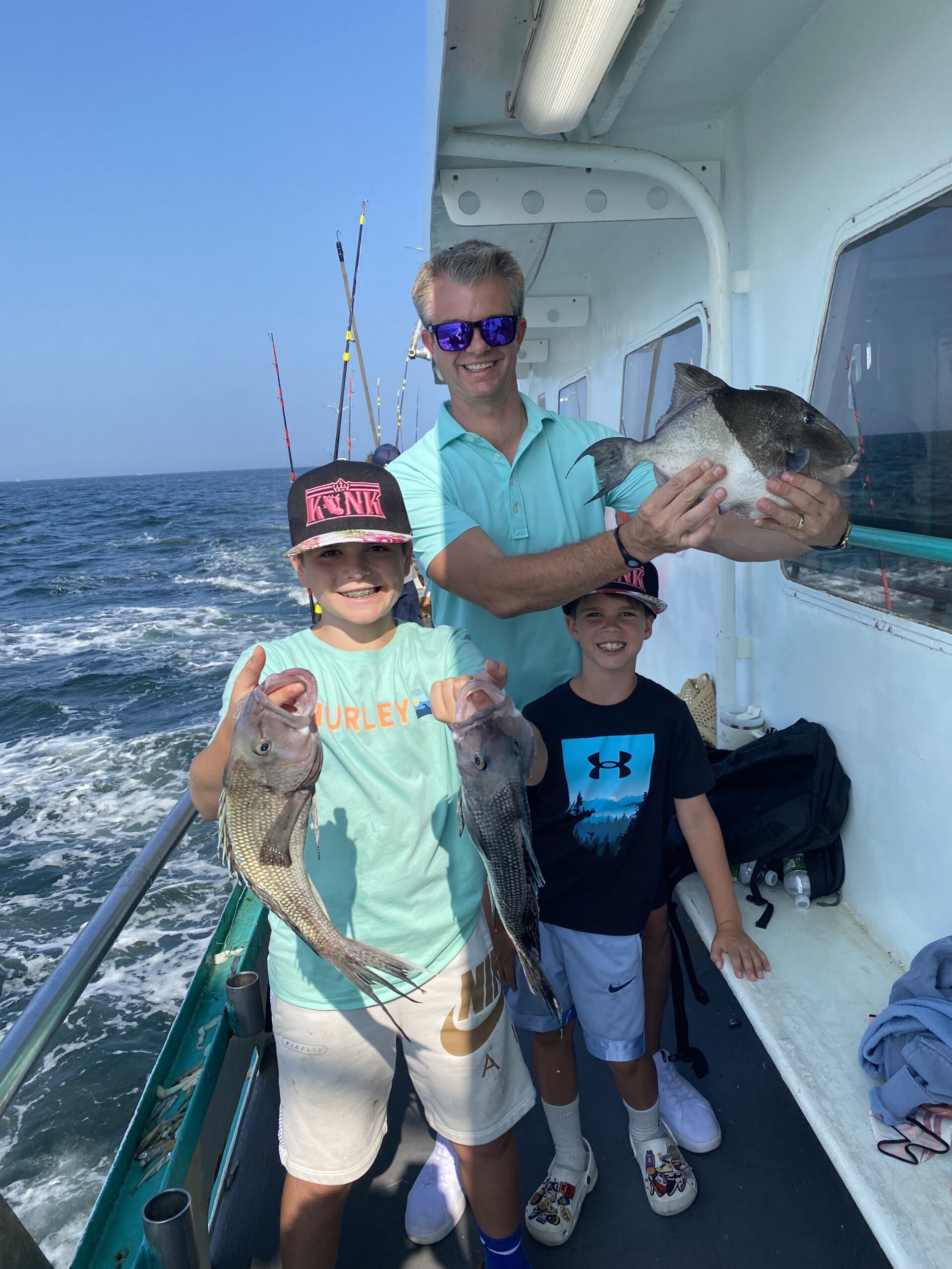 a man and a woman standing on a boat