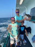a man and a woman standing on a boat