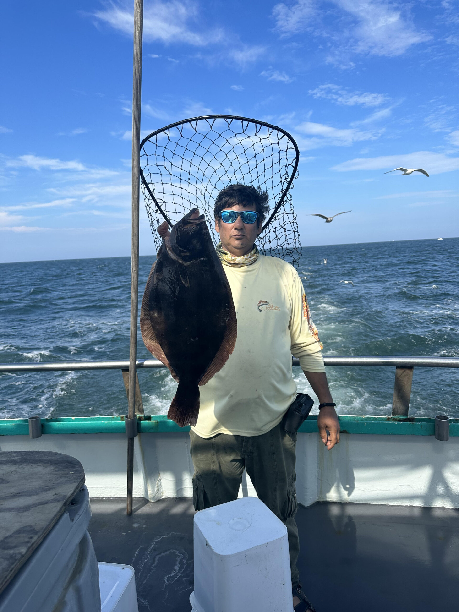 a person standing next to a body of water