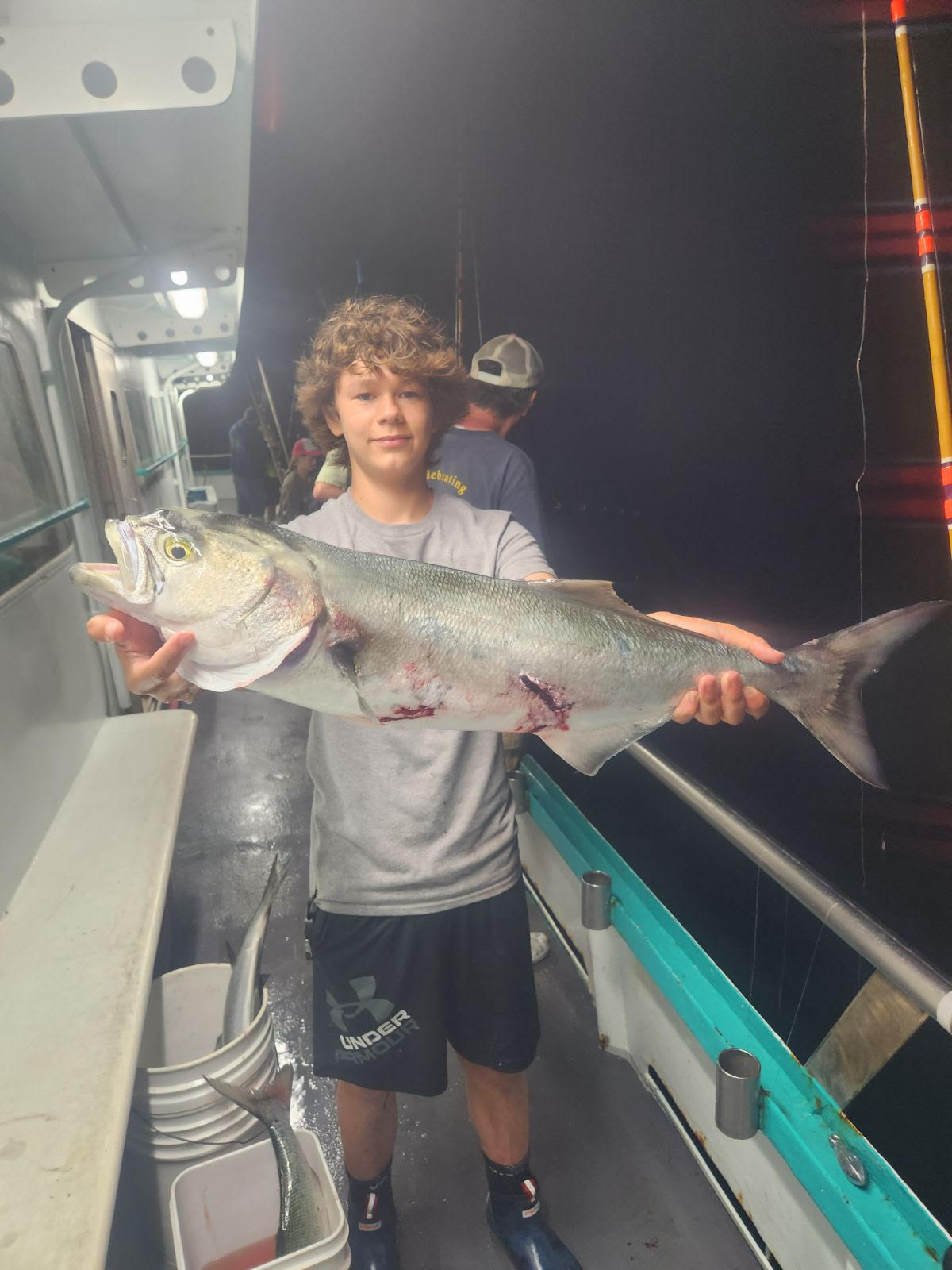 a man holding a fish