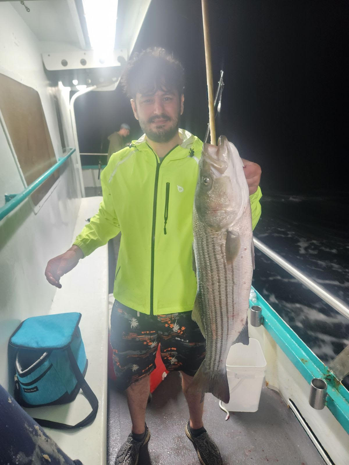 a person holding a fish