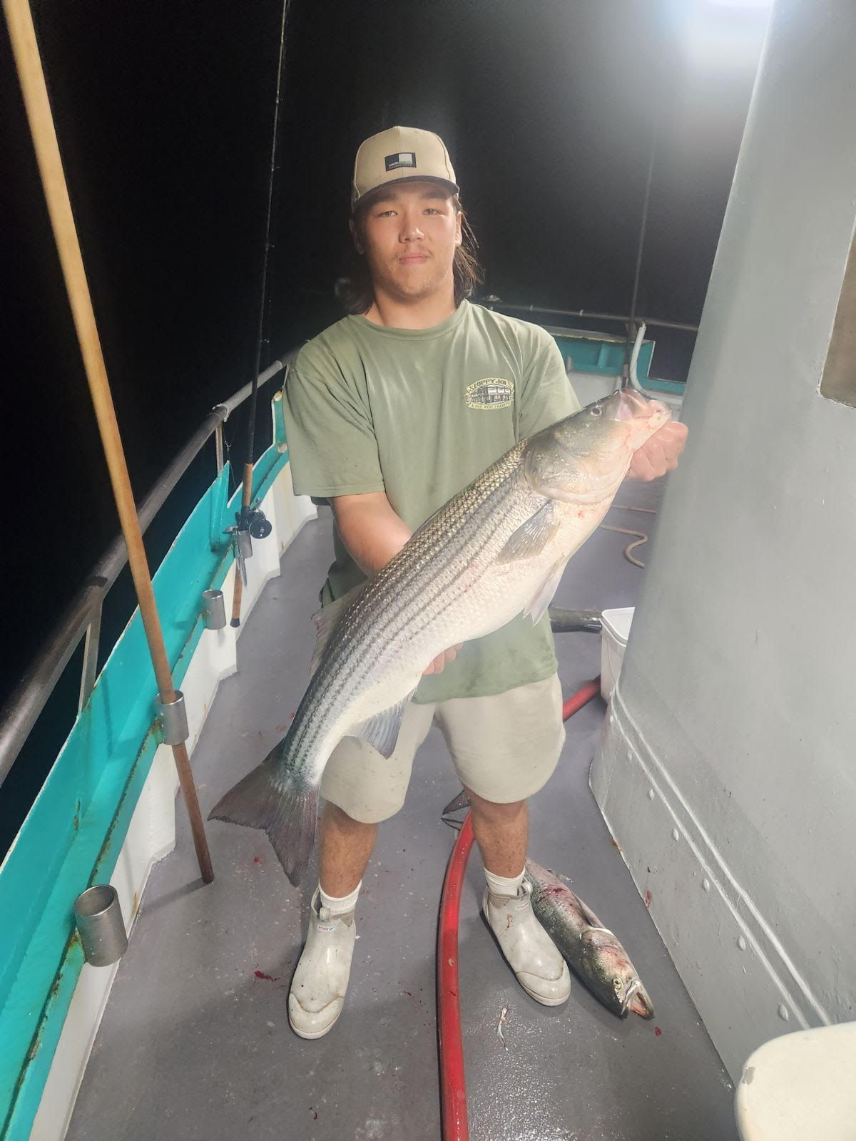 a person holding a fish