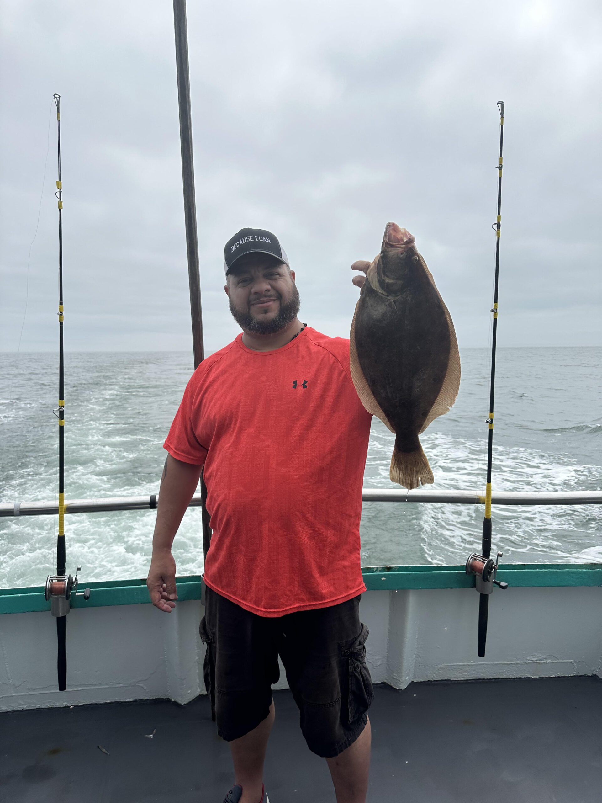 a man standing next to a body of water