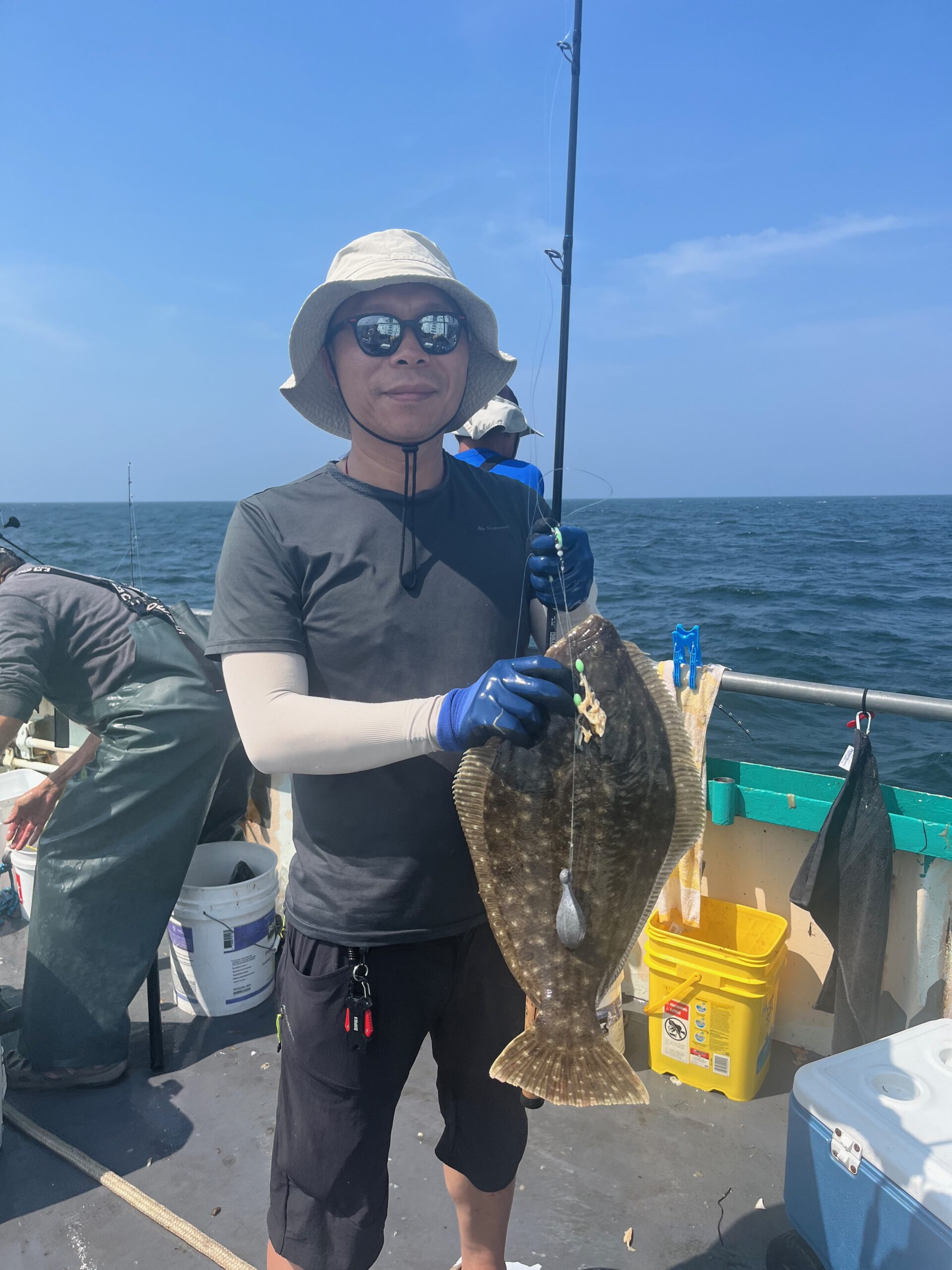 a man and a woman standing next to a body of water