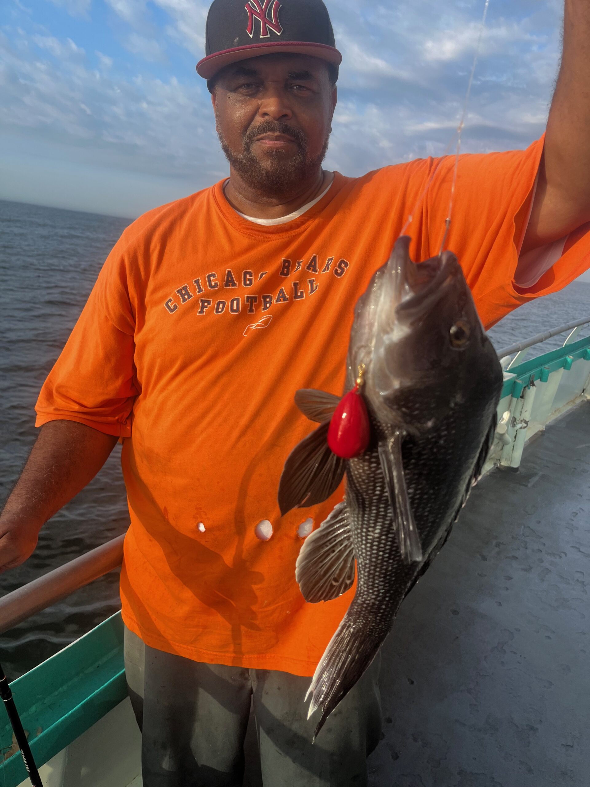 a man holding a fish