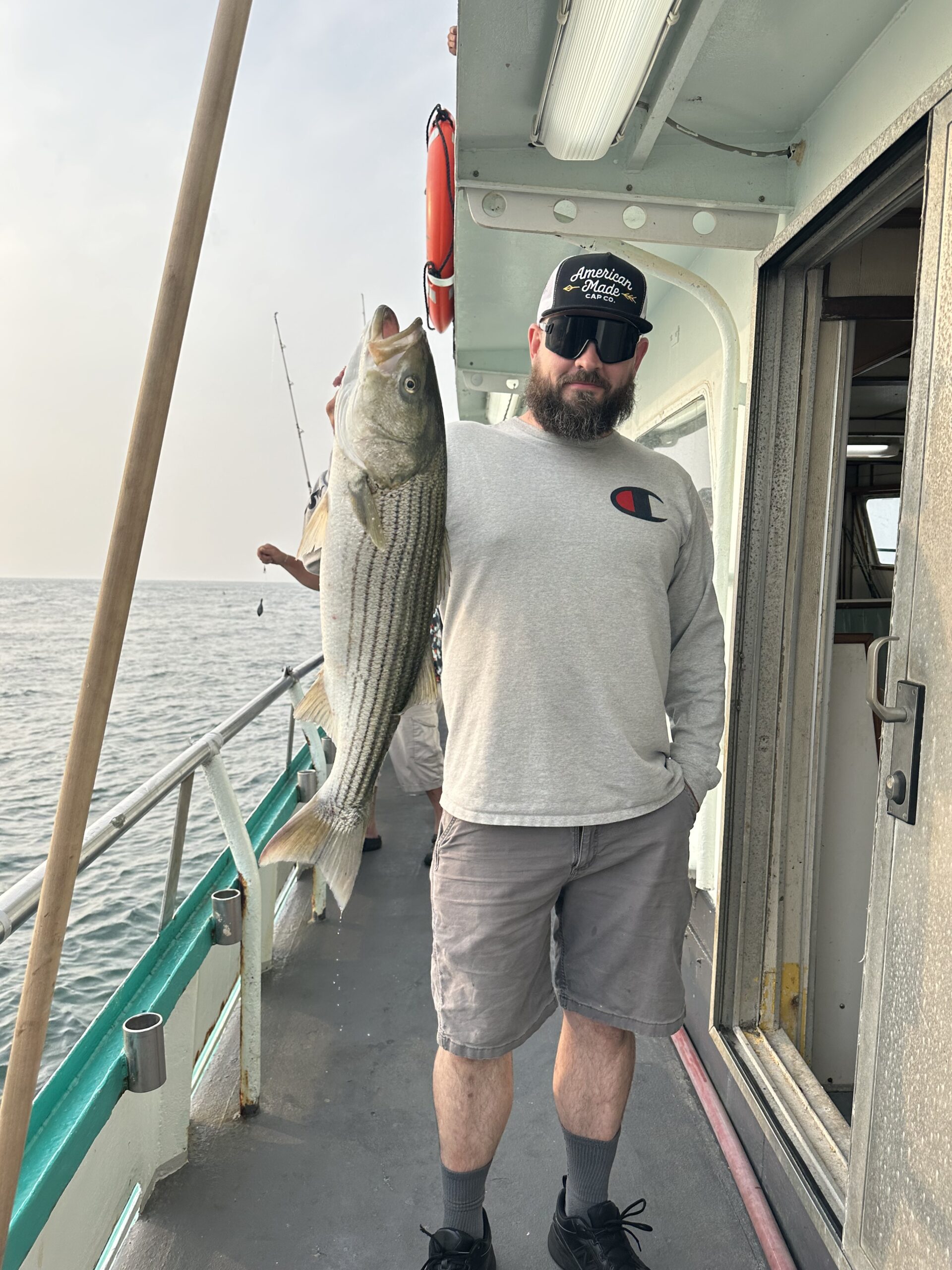a man holding a fish