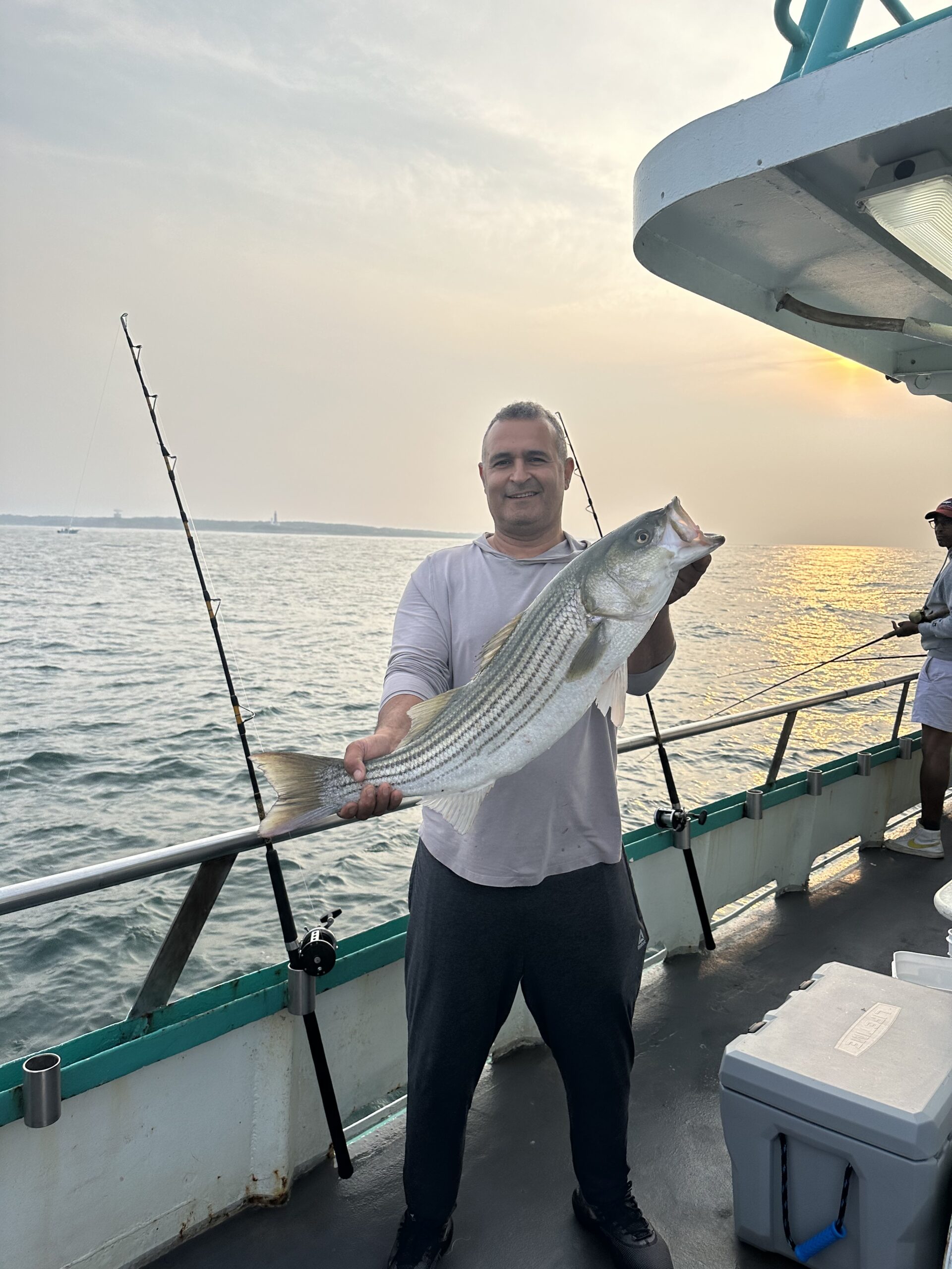 a man standing on a boat in the water