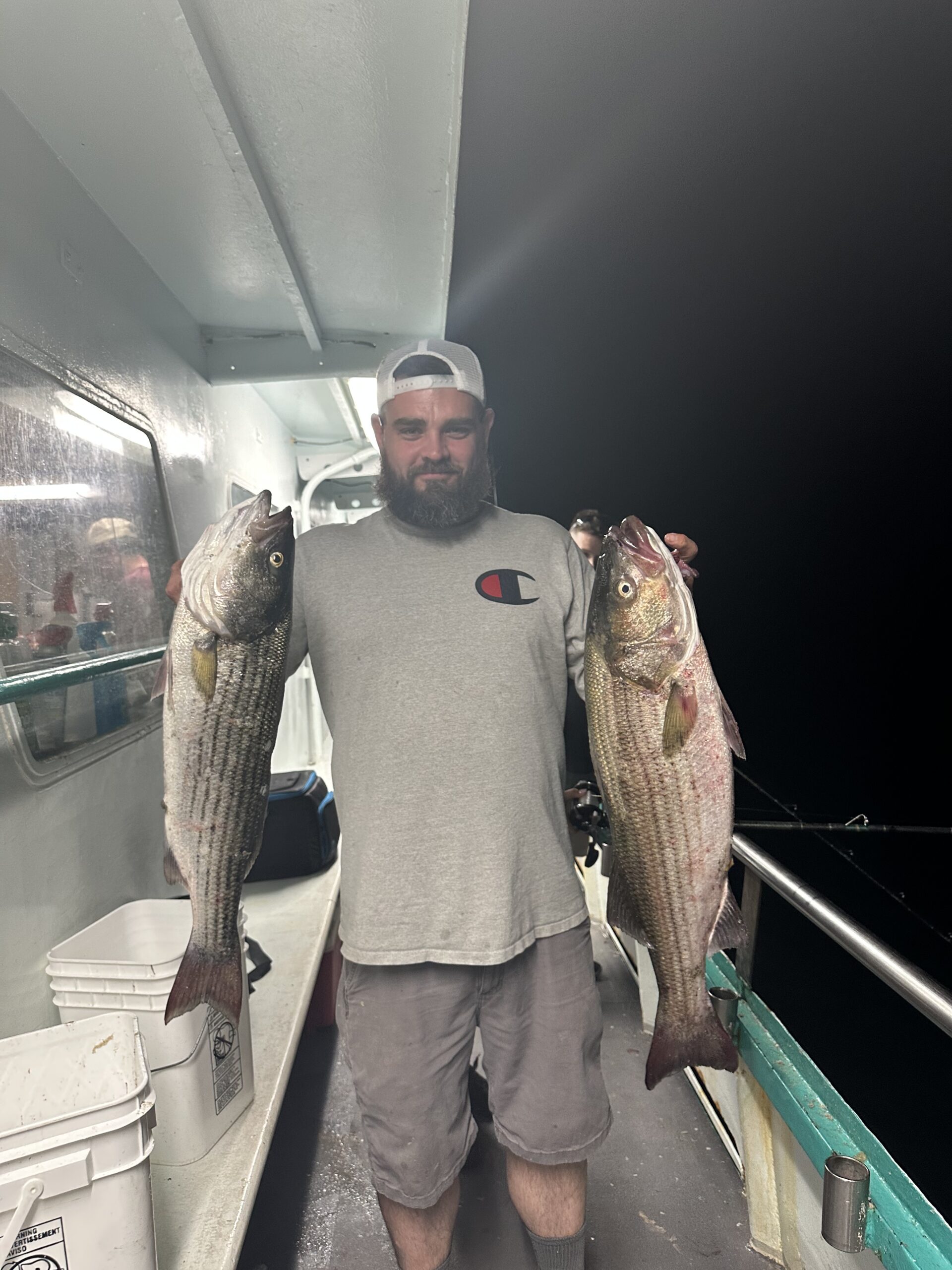 a man holding a fish