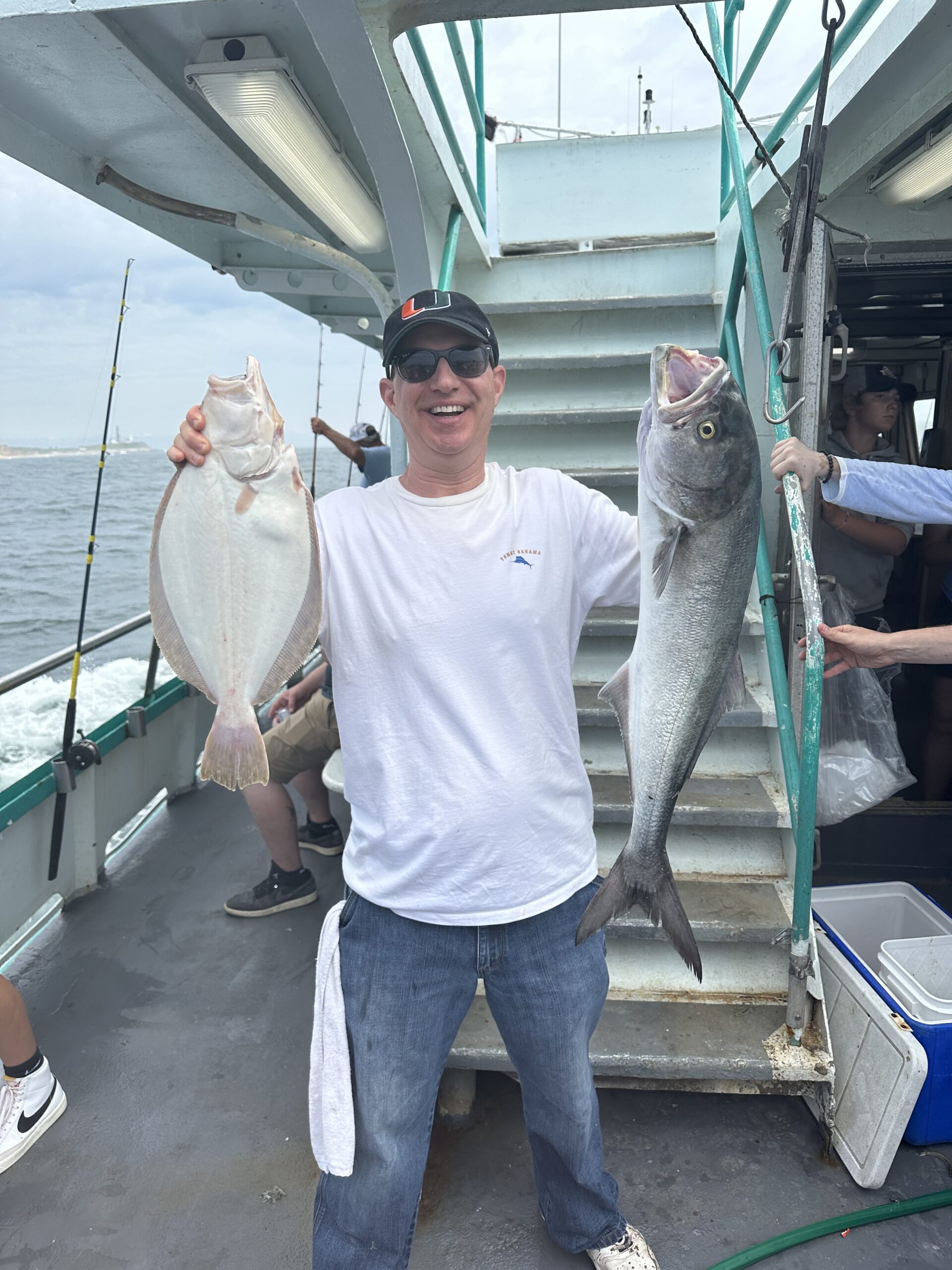 a man holding a fish