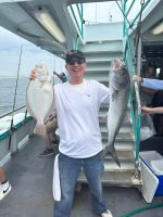 a man holding a fish