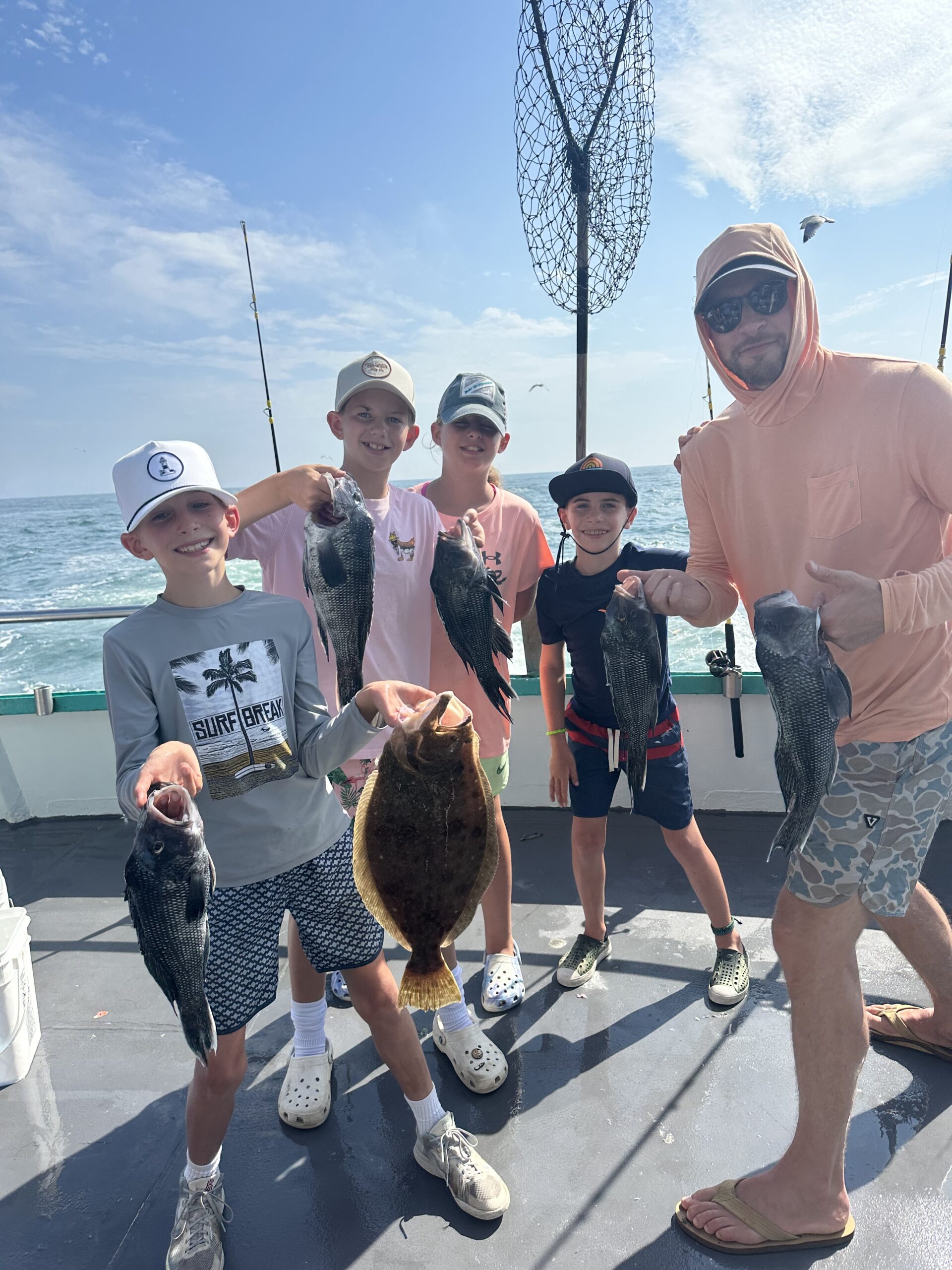 a group of people standing in a parking lot