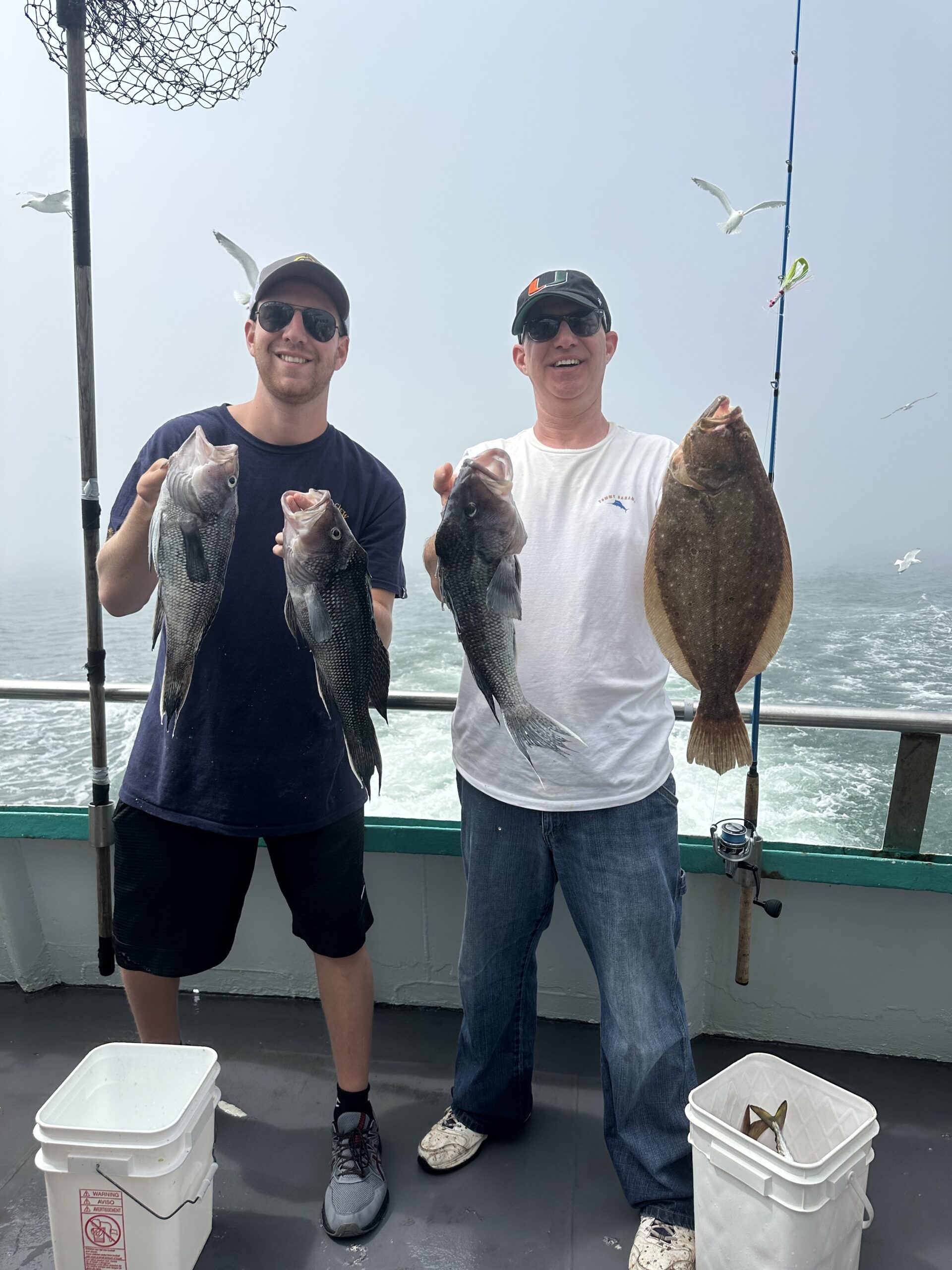 a group of people standing together smiling for the camera