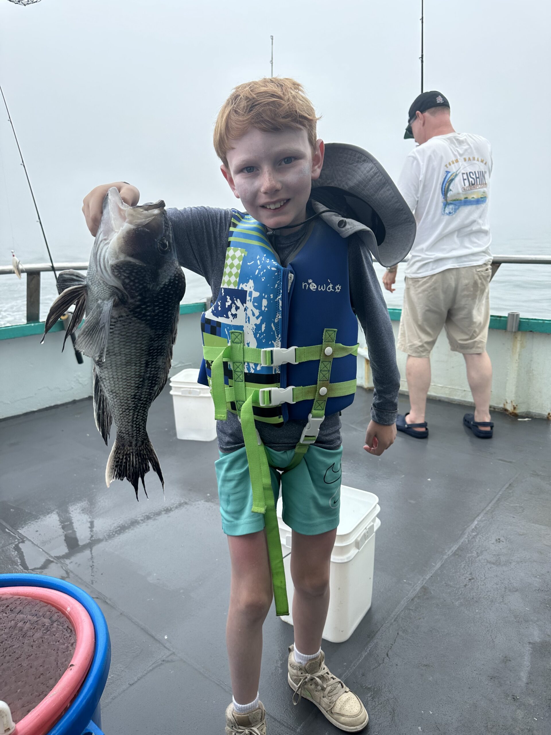 a man holding a fish