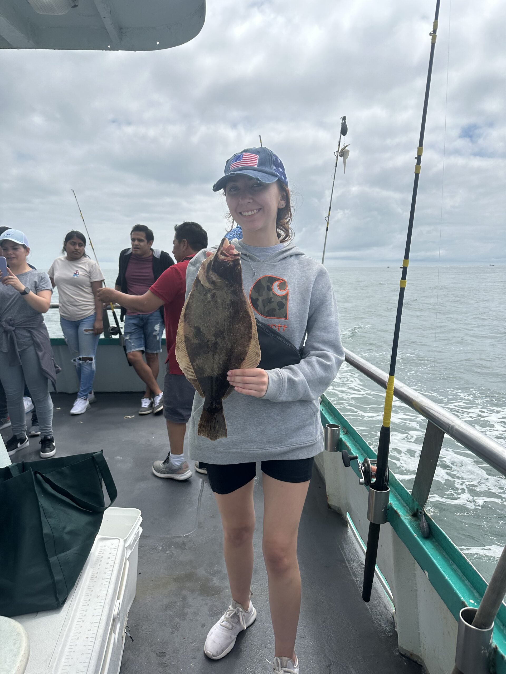 a group of people standing on a boat