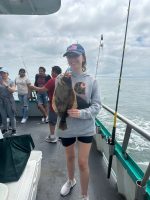 a group of people standing on a boat
