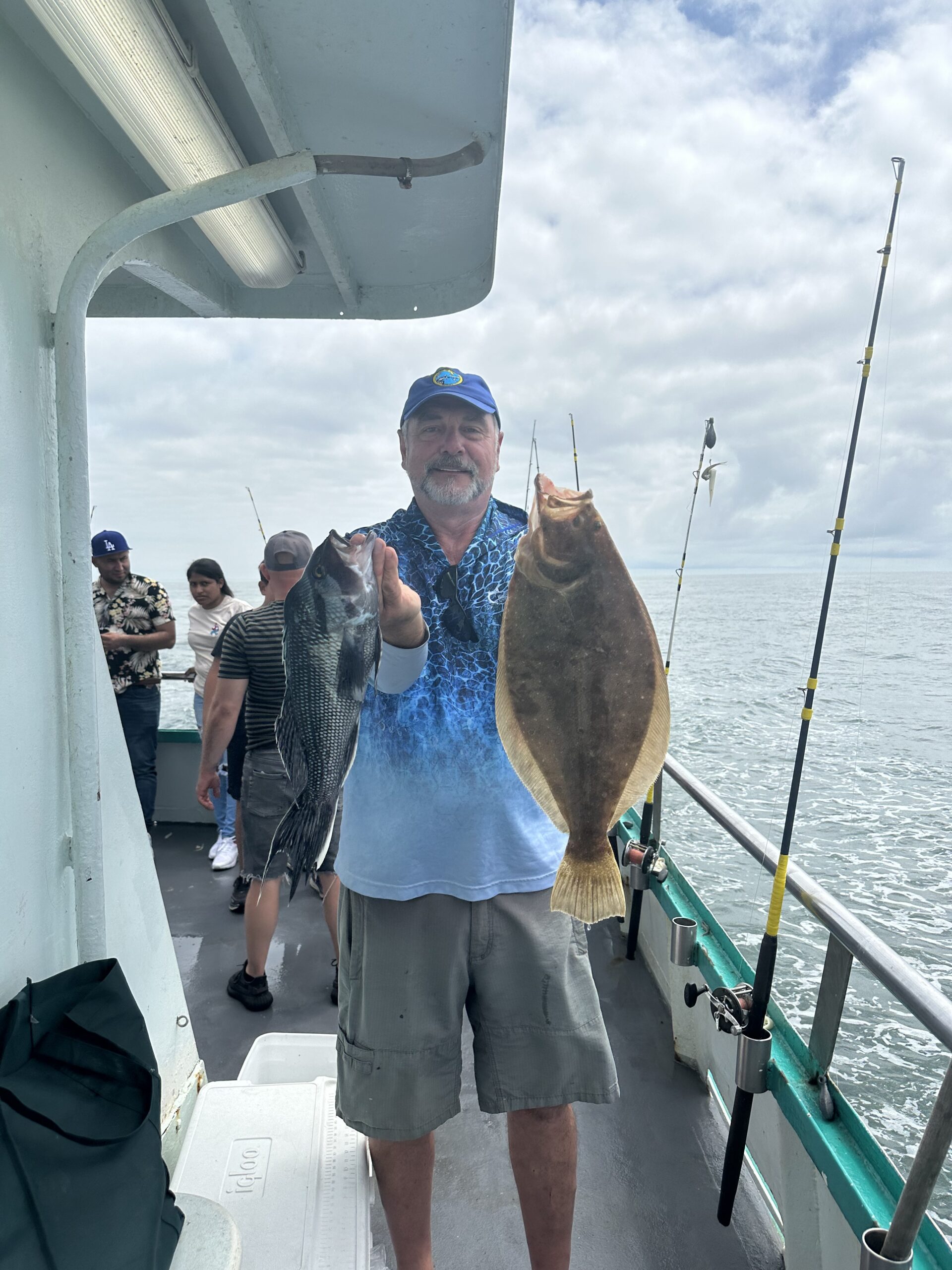 a group of people standing on a boat