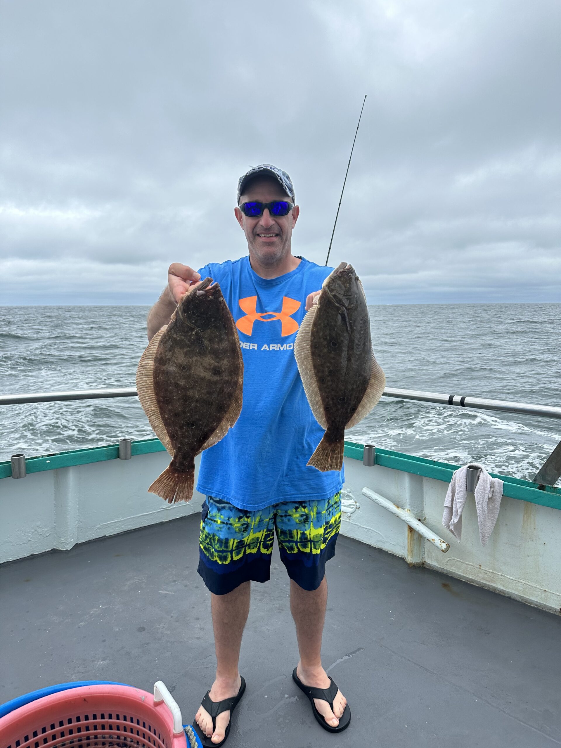 a person standing next to a body of water