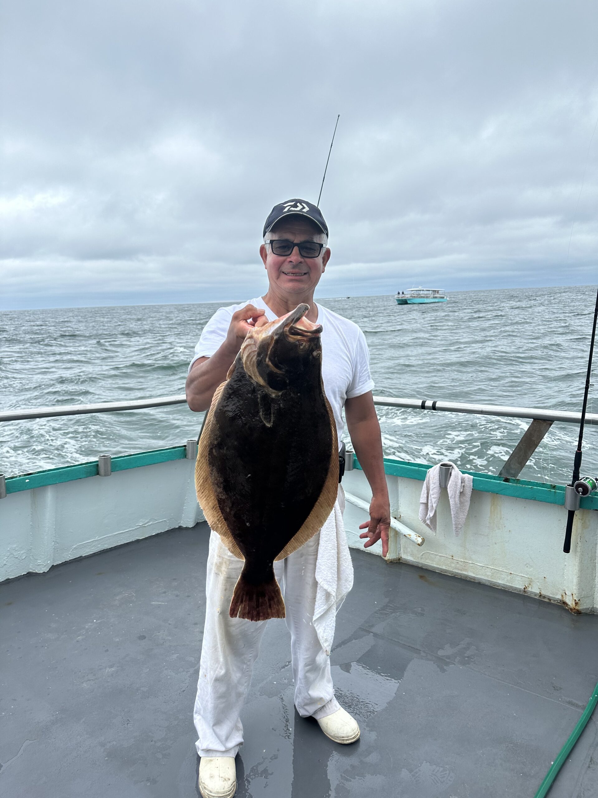 a person holding a fish in the water
