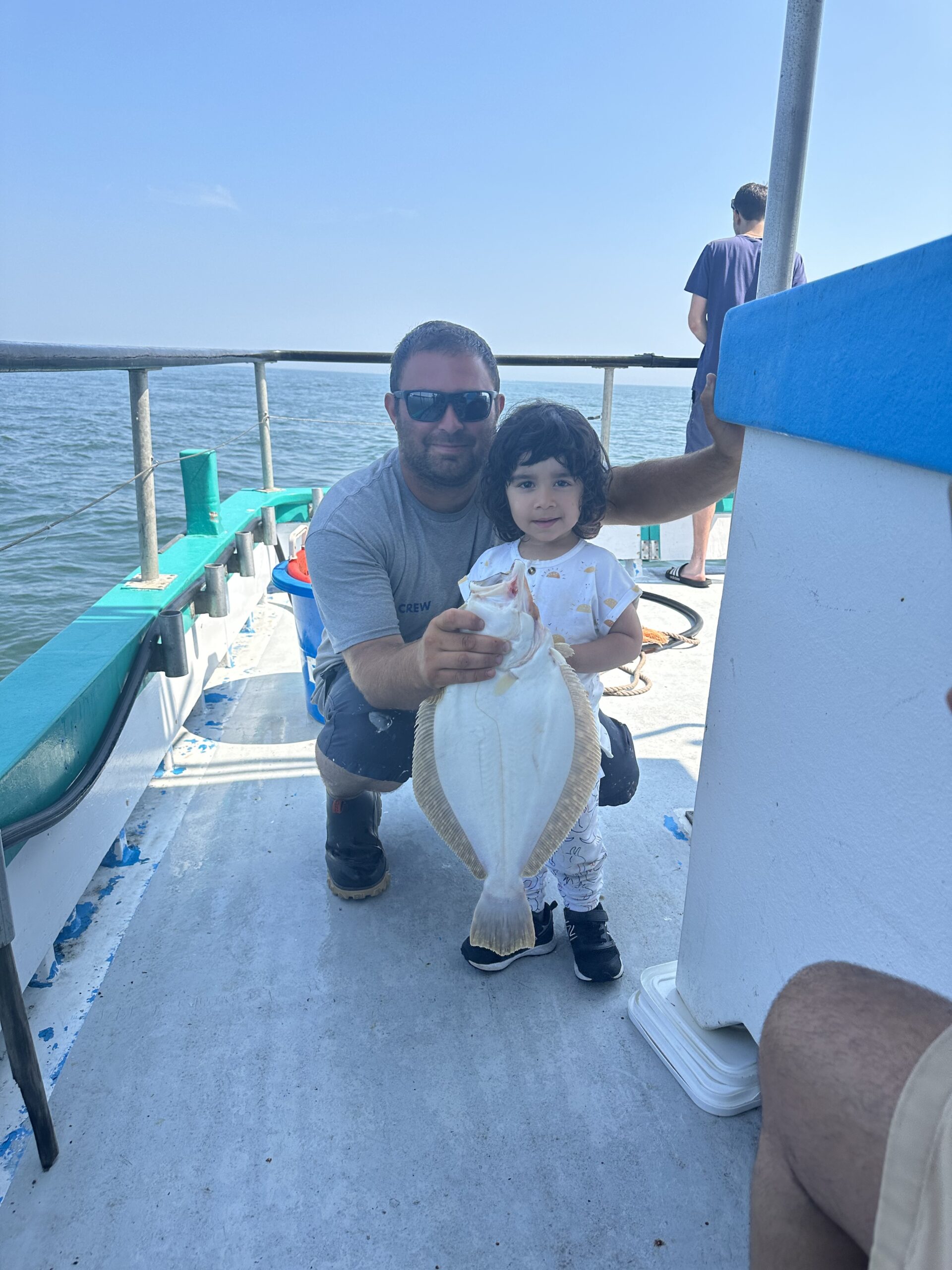 a man sitting on a boat in the water