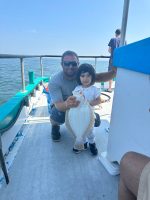 a man sitting on a boat in the water