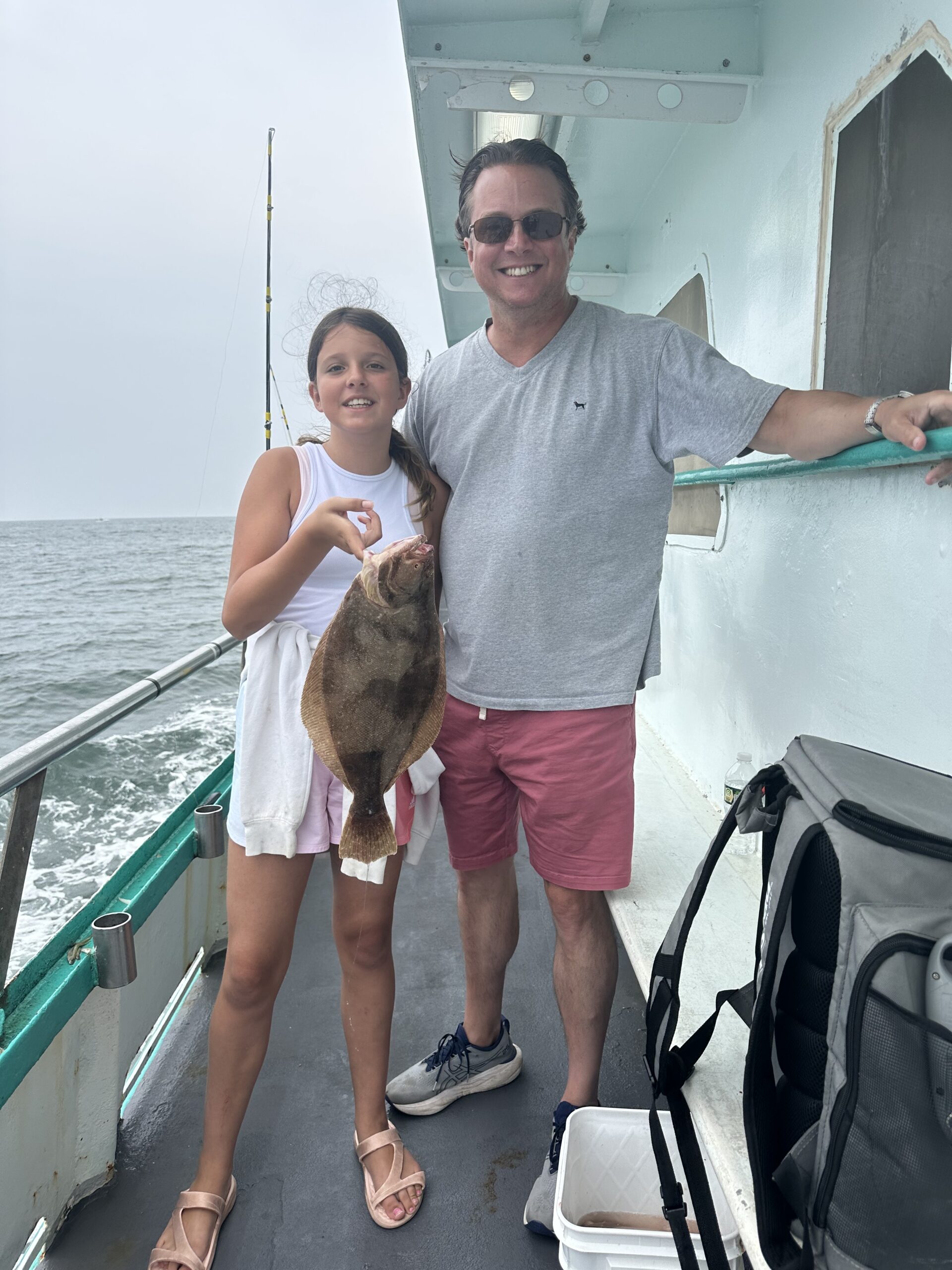 a group of people standing on a boat