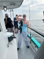 a group of people on a boat in the water