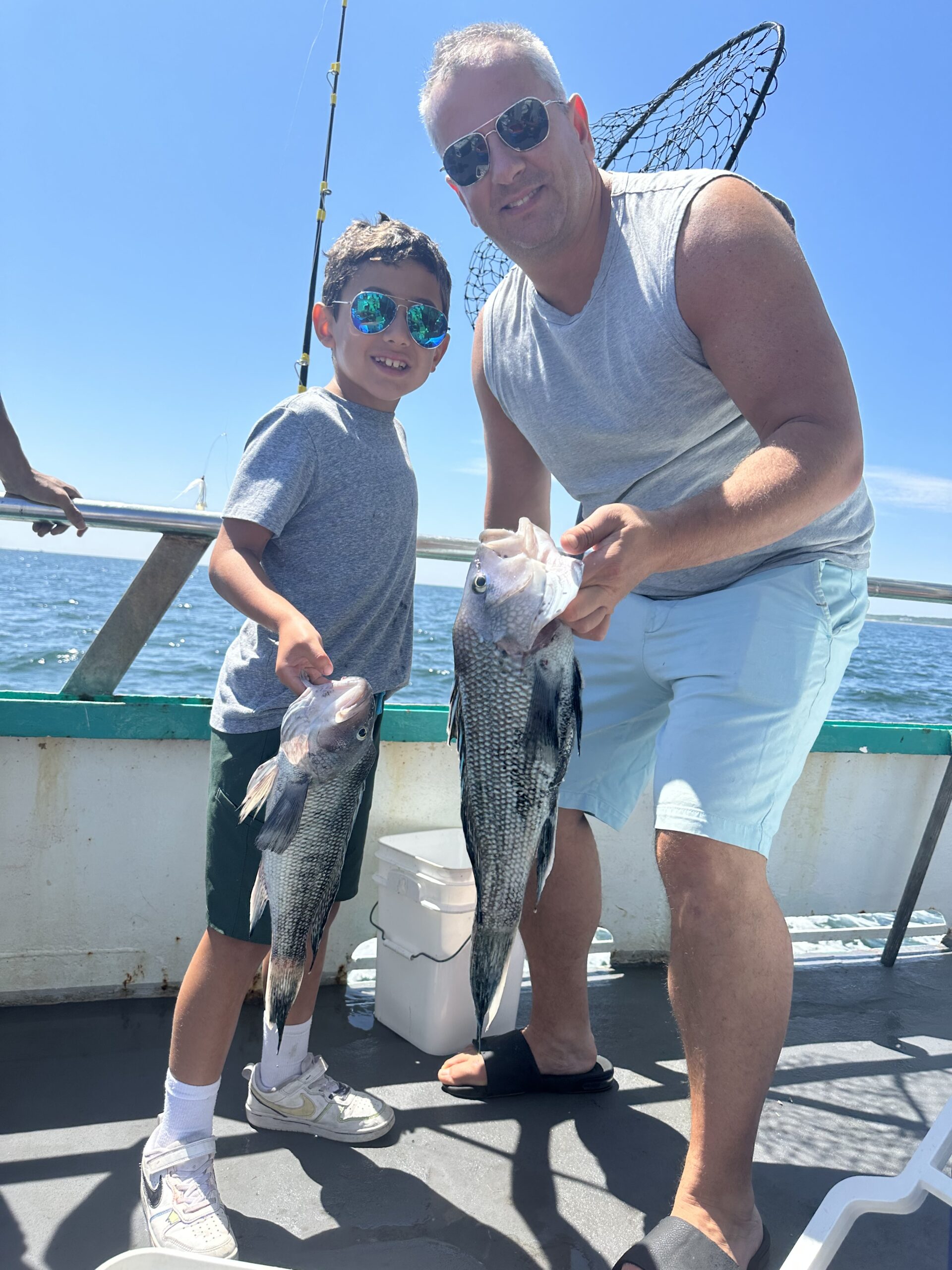 a man standing next to a dock