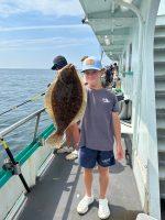 a man standing on a boat in the water