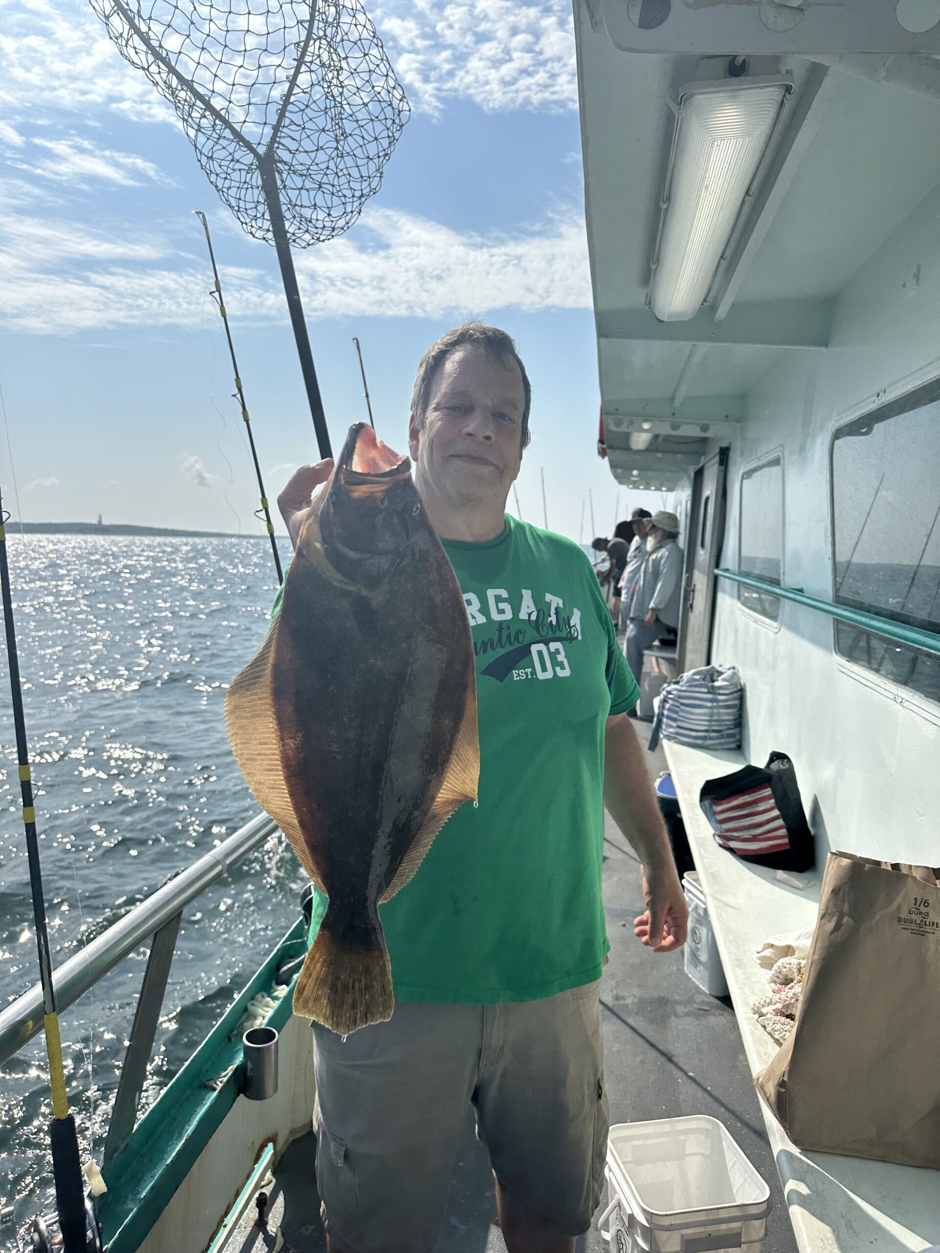 a man holding a fish