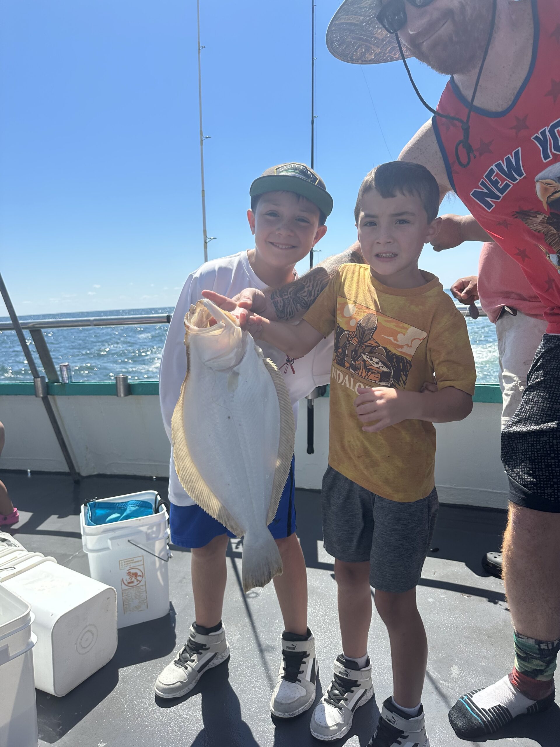 a man holding a fish