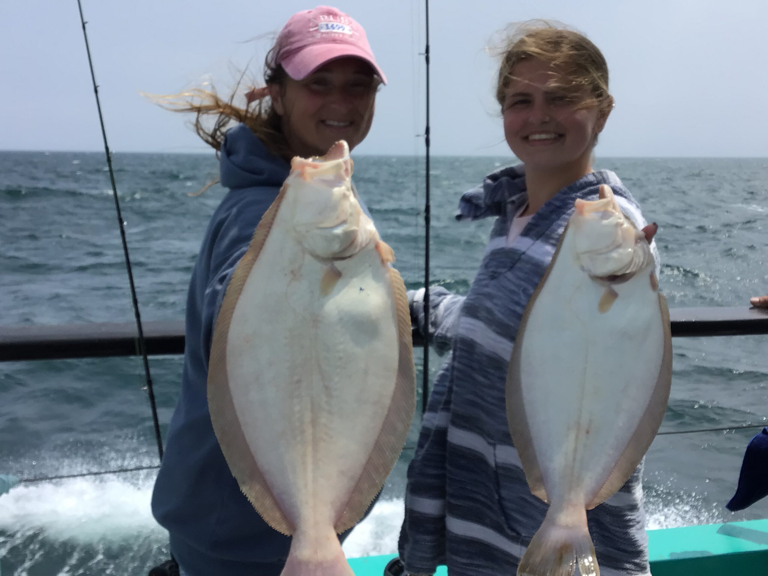 a person holding a fish in the water