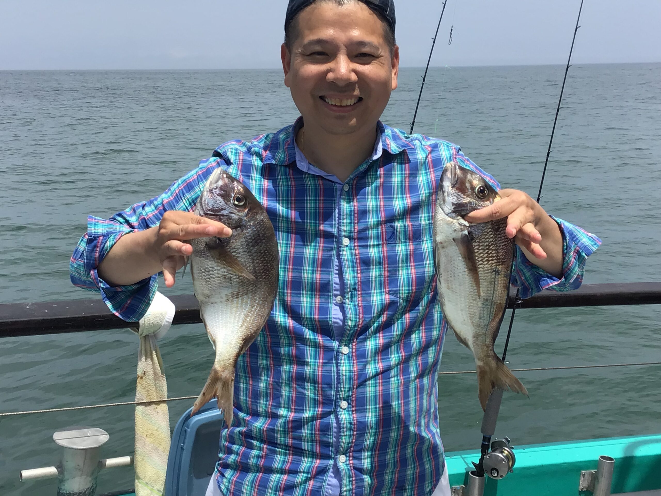 a man holding a fish in the water