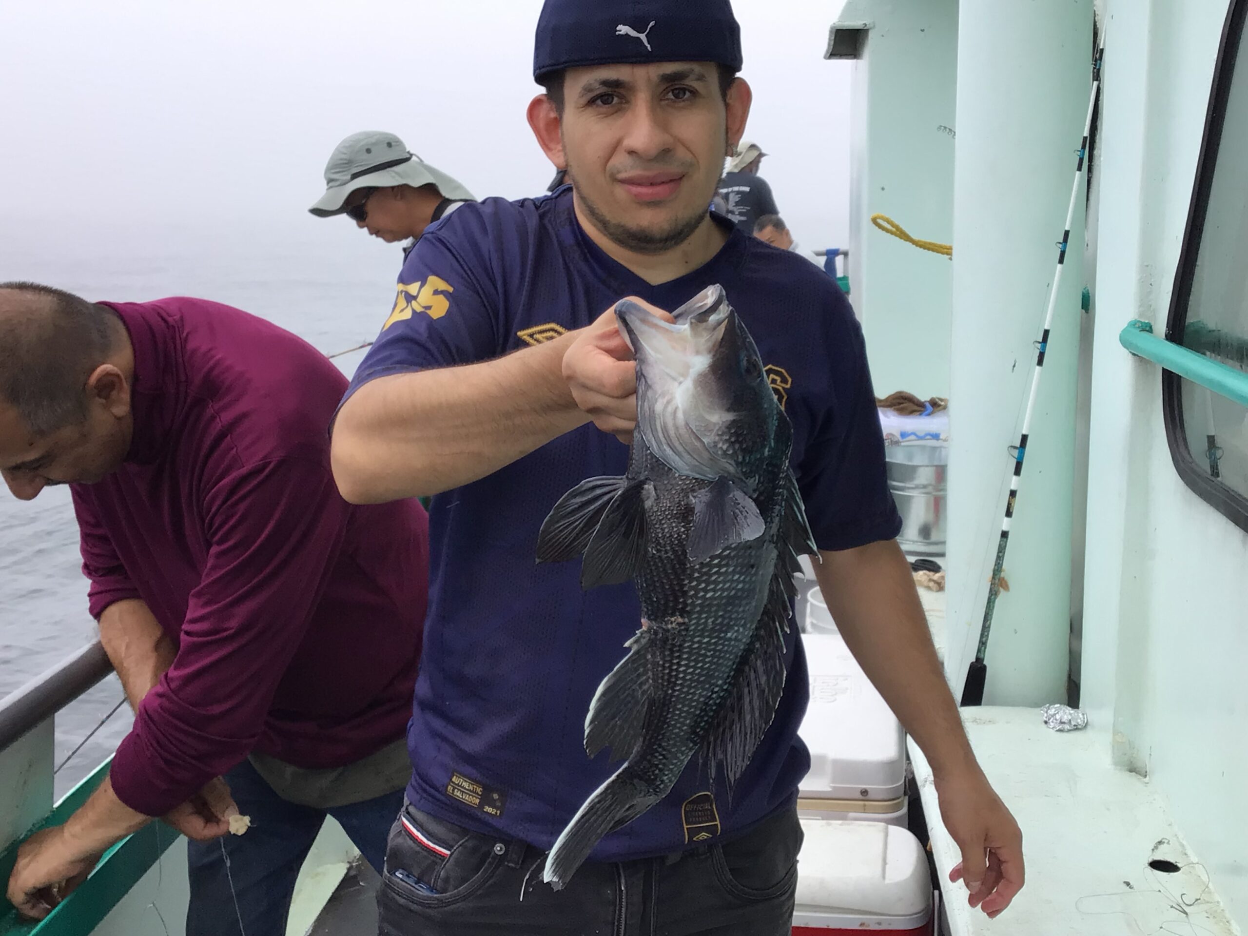 a person holding a fish